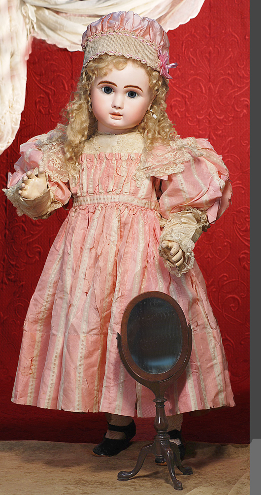 Thirty-two-inch grand size of the Steiner 'Figure A' bebe  with wire-lever eyes and silk couturier frock. Image courtesy Frasher's Doll Auctions. 